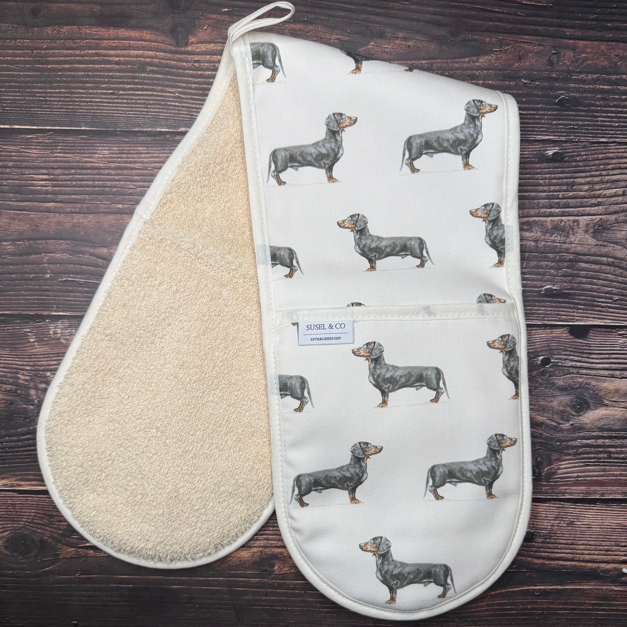 Dachshund double oven gloves hanging in a kitchen