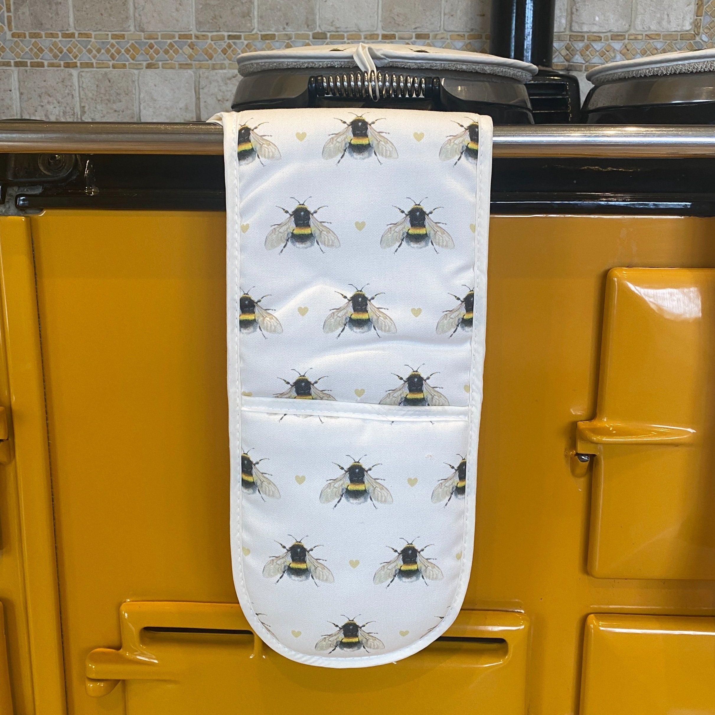 Bumble Bee double oven gloves hanging in a kitchen