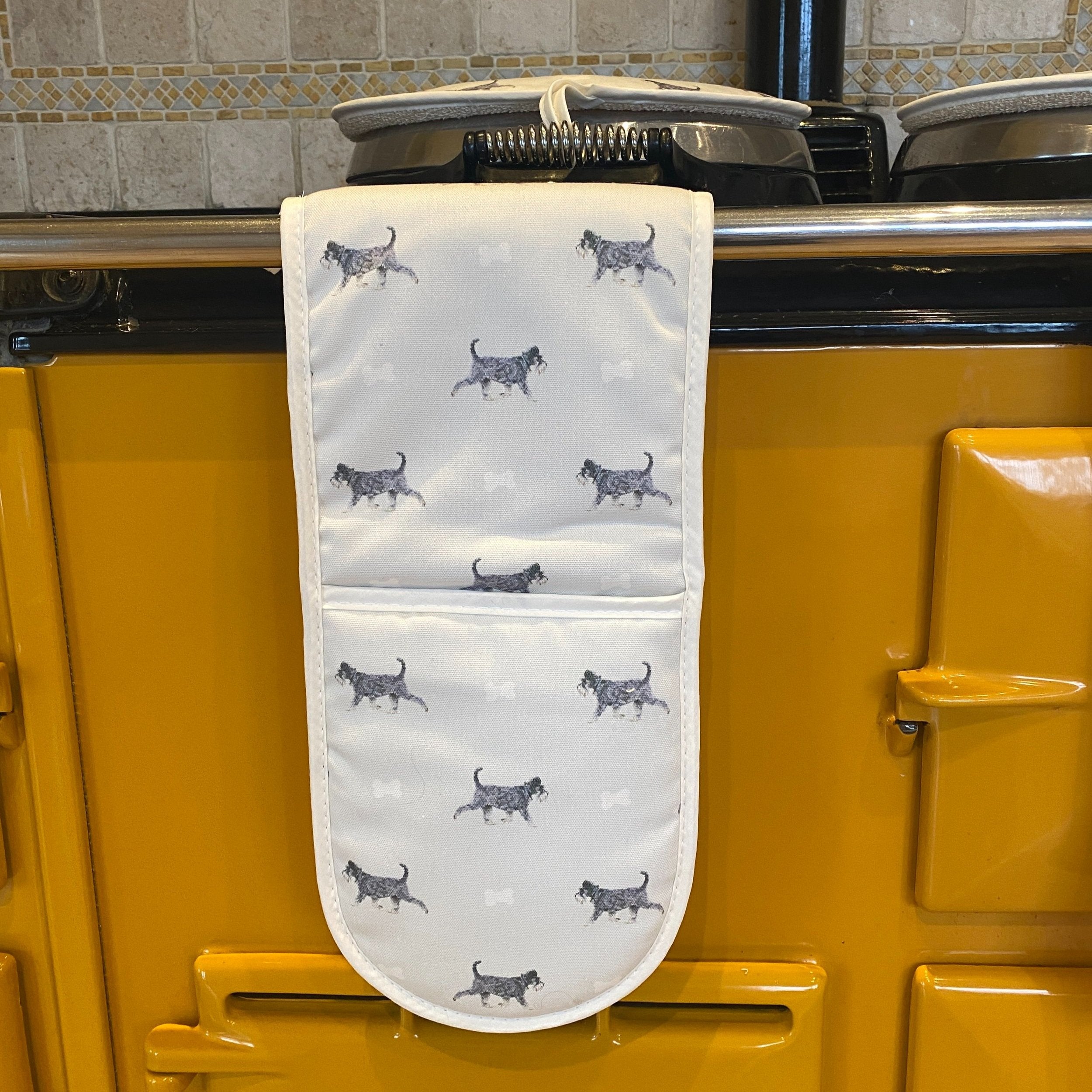 Schnauzer double oven gloves hanging in a kitchen