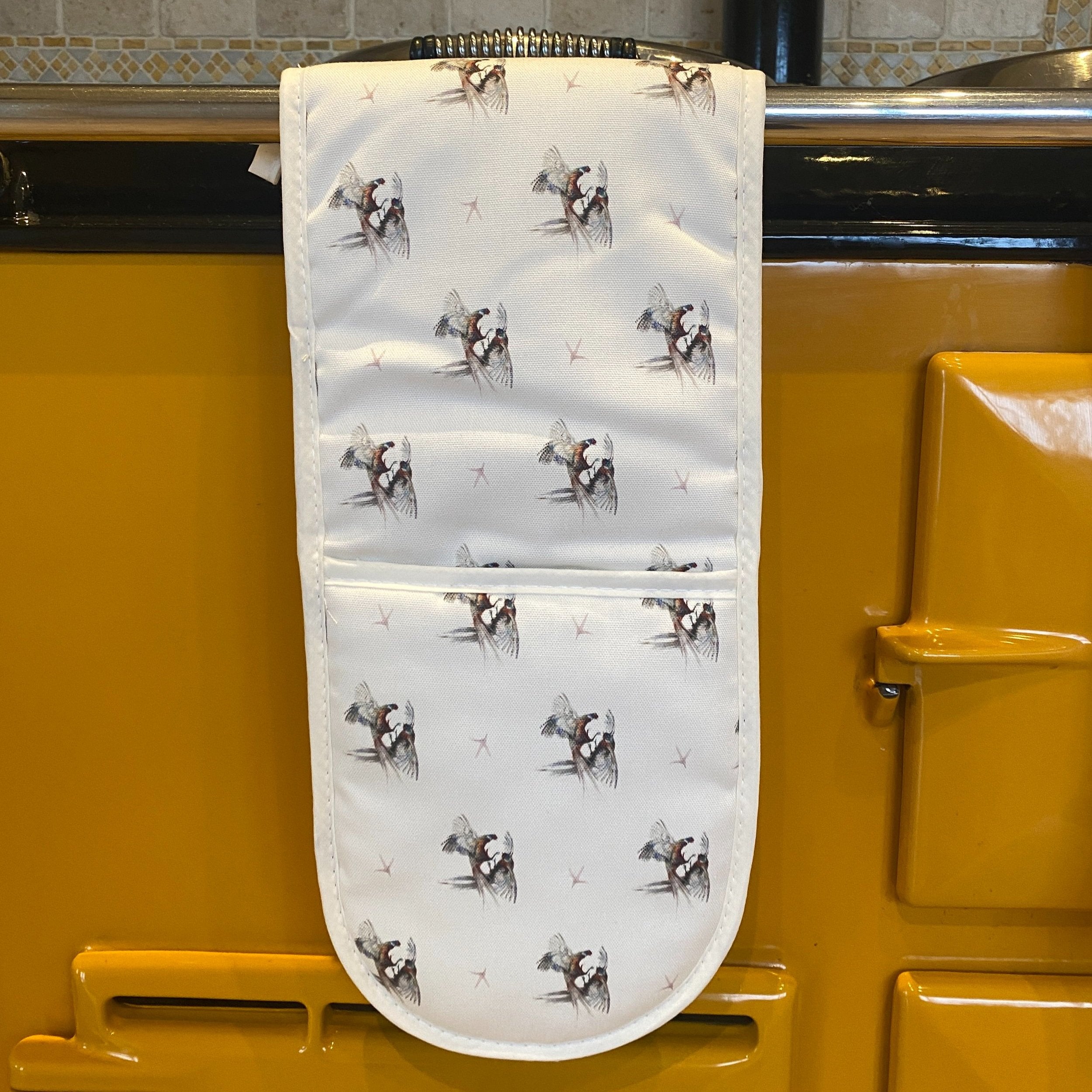 Cockfight double oven gloves hanging in a kitchen