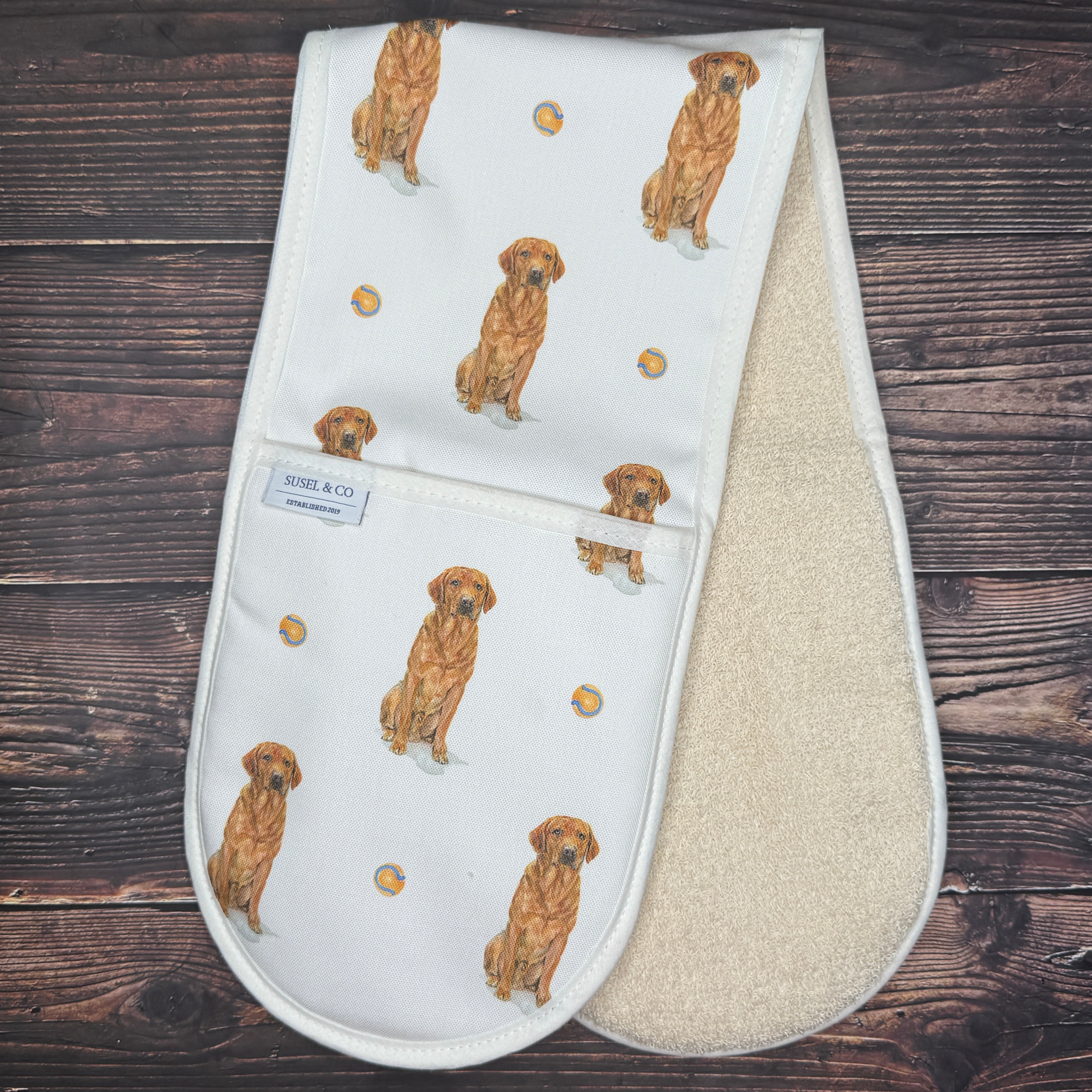 Fox Red Lab double oven gloves hanging in a kitchen