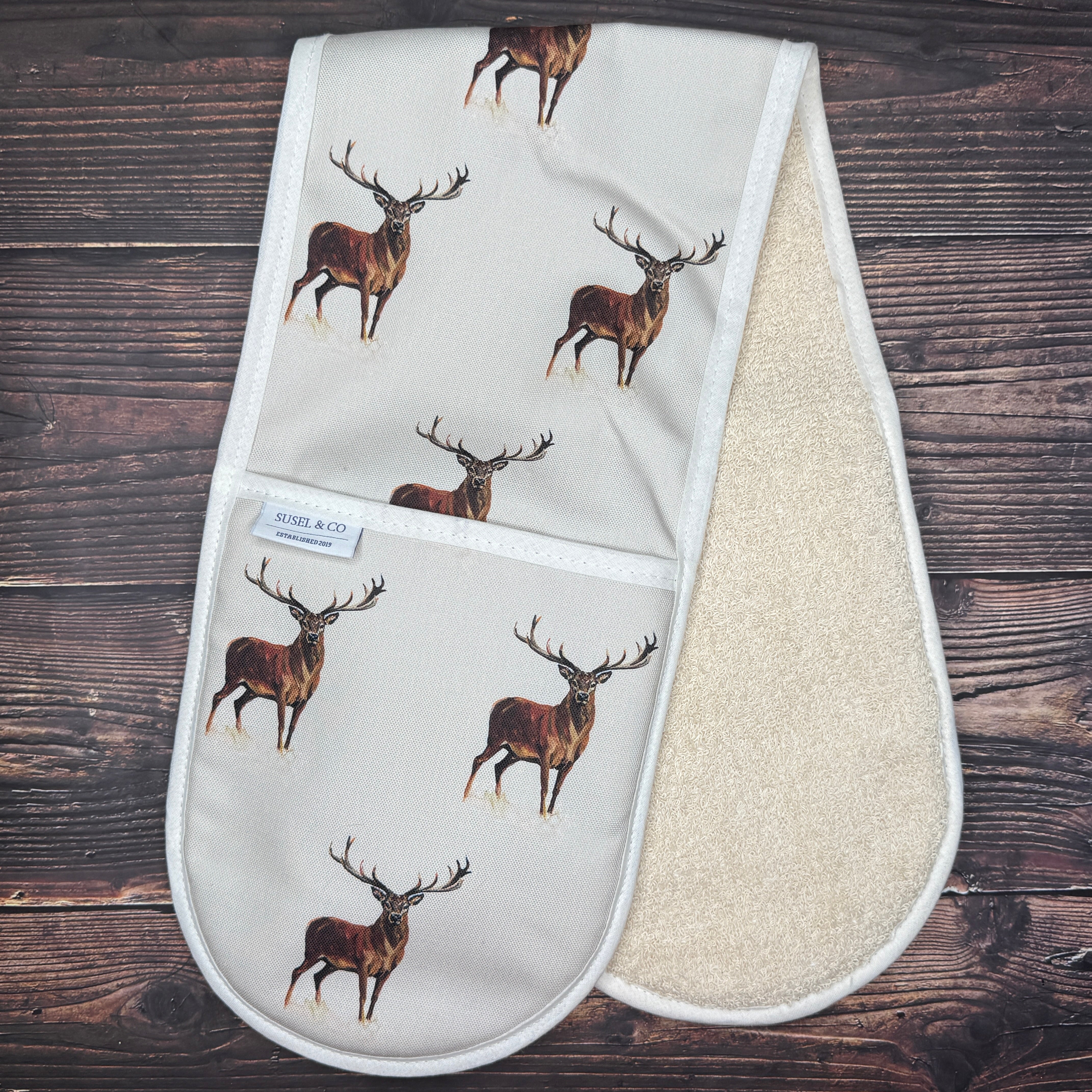 Red Deer double oven gloves hanging in a kitchen