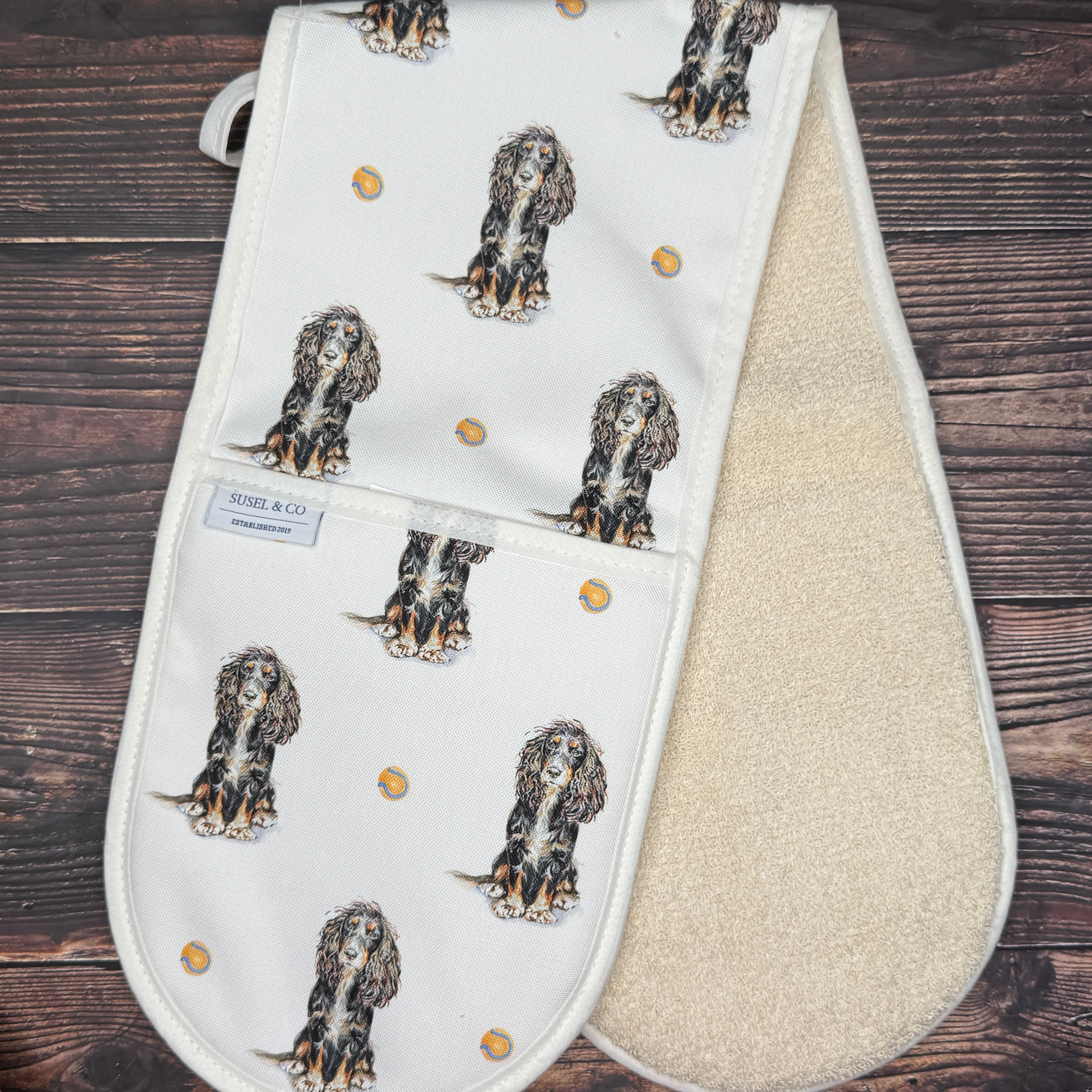 Spaniel double oven gloves hanging in a kitchen