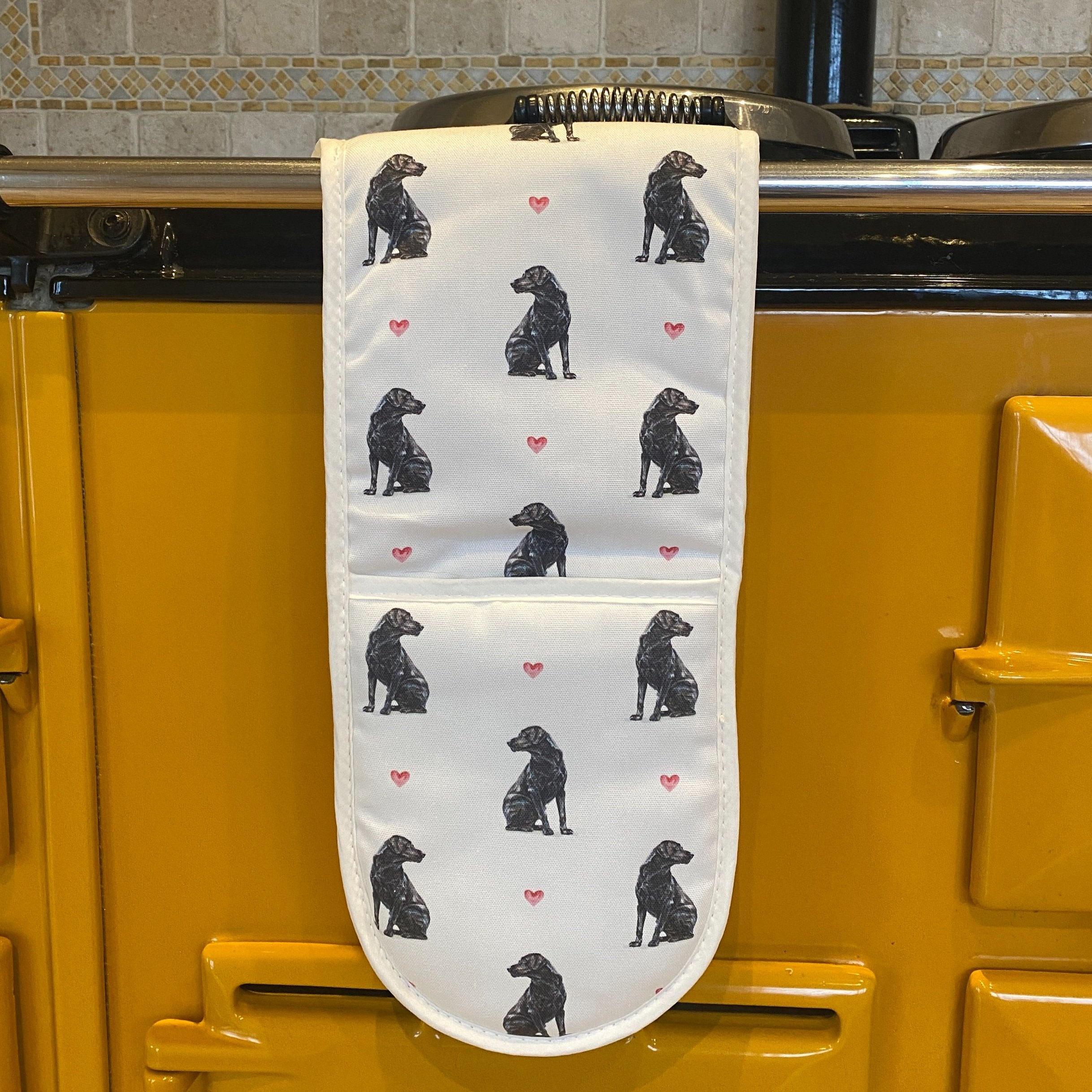 Black Lab double oven gloves hanging in a kitchen