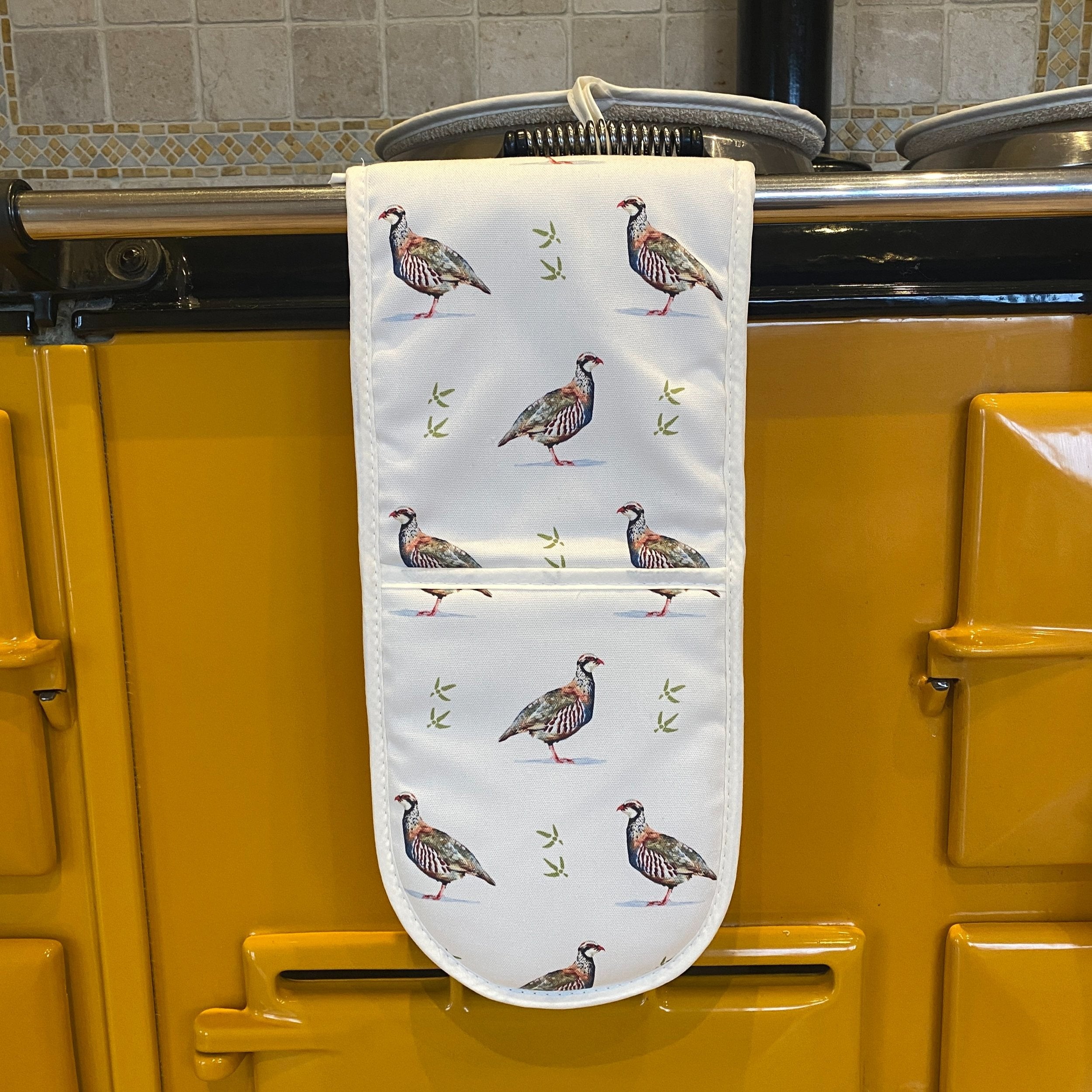 Partridge double oven gloves hanging in a kitchen