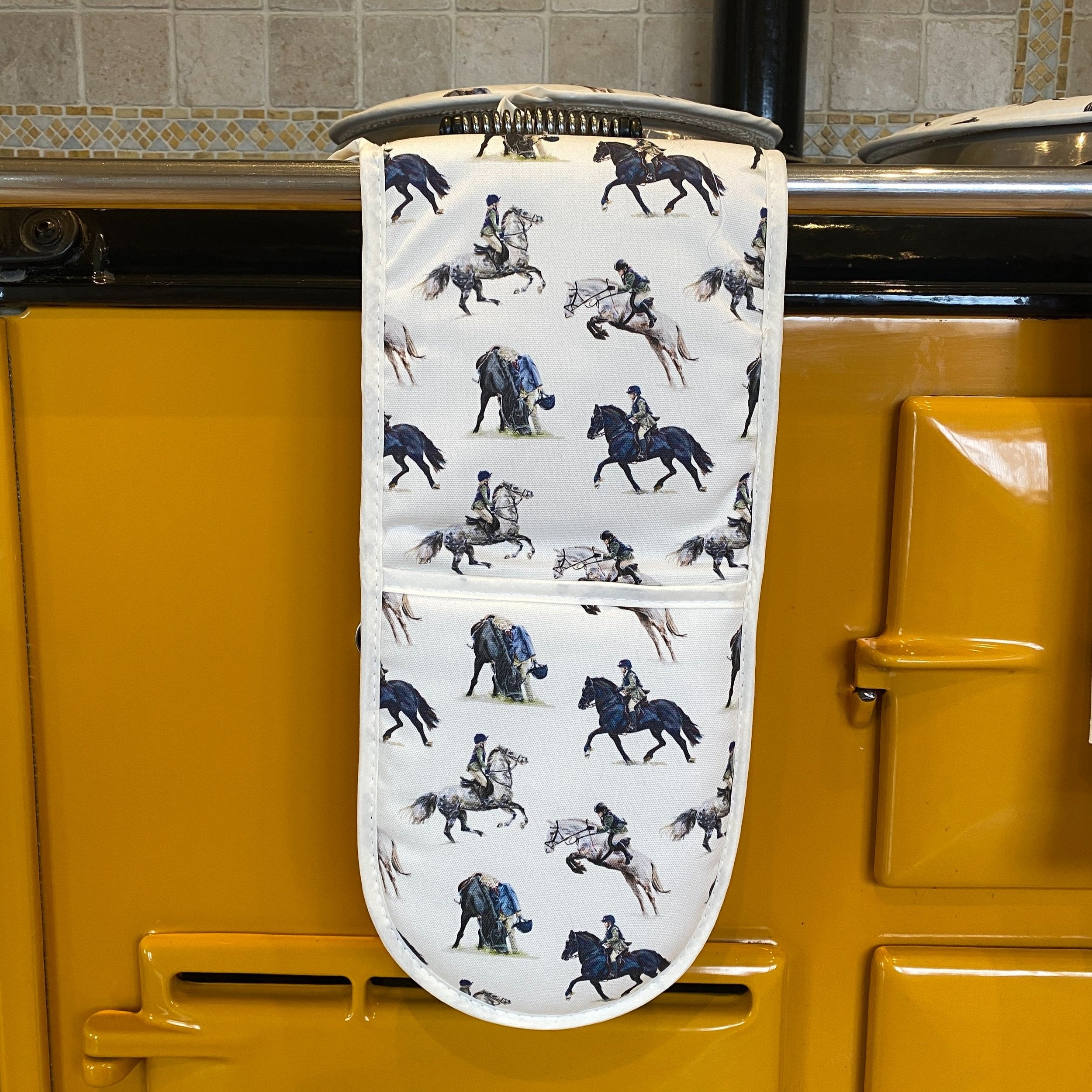 Pony Club double oven gloves hanging in a kitchen